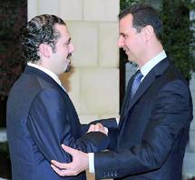 Consécration de la normalisation entre le Liban et la Syrie : Poignée de main historique entre Assad et Hariri Consécration de la normalisation entre le Liban et la Syrie : Poignée de main historique entre Assad et Hariri